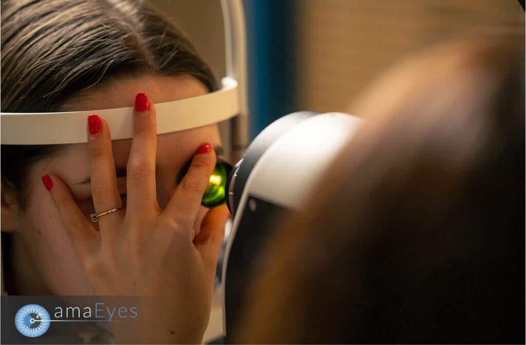 Patient undergoing a pre-LASIK eye examination using diagnostic imaging equipment.